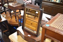 A 19th Century mahogany toilet mirror with drawer base