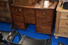 A 19th Century mahogany dressing or similar chest having bow front and Regency brass handles