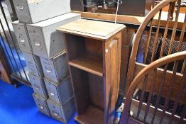 A modern oak narrow shelf unit
