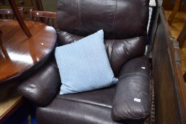 A modern brown leather electric recliner chair