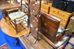 A early 20th Century mahogany folding cake stand and a vintage oak tea trolley