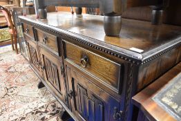 An Old Charm/Priory style dark oak sideboard