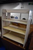 Two painted low bookshelves, open backs