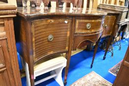 A reproduction Regency serpentine front sideboard