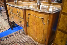 A mid 20th Century walnut sideboard in the Epstein style