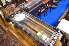 A 19th Century Vienna style mahogany cased wall clock