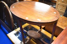 An Edwardian mahogany oval occasional table