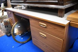 A vintage teak effect laminate desk