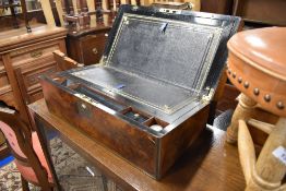 A 19th Century walnut lap desk, with brass presentation plaque dated 1899