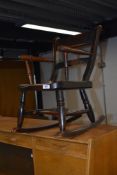 A 19th Century stained frame child's rocking chair