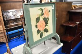 A vintage folding firescreen table