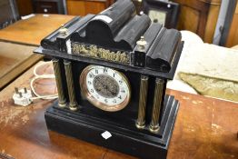 A Victorian black slate mantel clock
