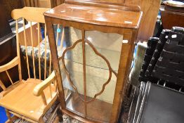 An early to mid 20th Century walnut display cabinet