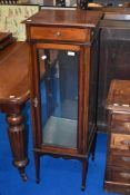 An Edwardian mahogany narrow display cabinet