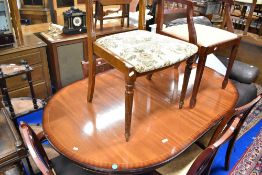 A reproduction Regency dining table and selection of similar chairs
