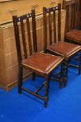 A pair of early 20th Century stained frame dining chairs