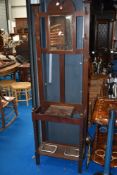 A late 19th or early 20th Century mahogany hall stand
