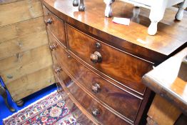 A Victorian mahogany bow fronted chest of two over three drawers