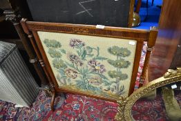 A mahogany framed tapestry fire screen