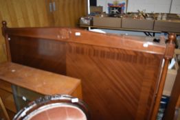 A modern mahogany double headboard with monogram decoration, NHB