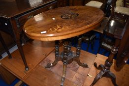 A Victorian occasional table having inlaid top, and quadruple turned supports