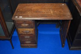 A Victorian oak desk of small proportions