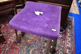 A vintage dressing table stool having metal frame and purple dralon upholstery