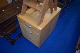 A modern beech effect laminate filing cabinet