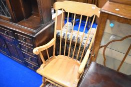 A traditional beech framed rocking chair