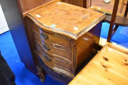 An early to mid 20th Century walnut bedside or similar chest having serpentine front