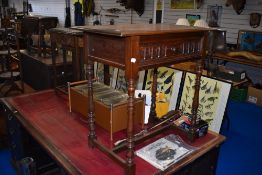 An early 20th Century oak Priory style side table with frieze drawer
