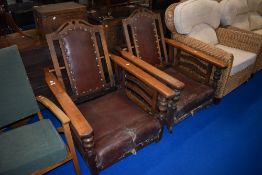 A pair of 19th Century oak reclining armchairs