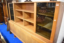 A vintage teak sideboard with part glazed top section