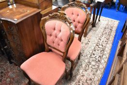A pair of reproduction upholstered dining chairs