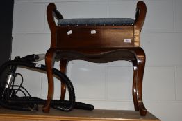 A late 19th or early 20th Century stained frame piano stool
