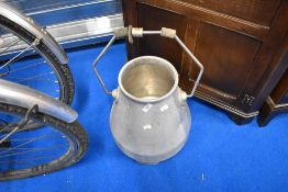 A vintage cream churn