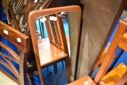 A vintage teak wall mirror