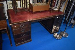 An early 20th Century mahogany partners style pedestal desk