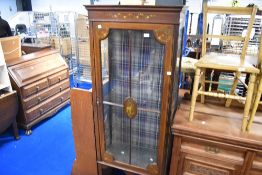 An Edwardian mahogany display cabinet having painted detailing