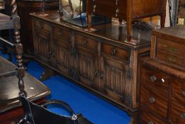 A traditional Priory or Old Charm style oak sideboard