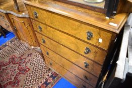 An early to mid 20th Century walnut chest of five drawers