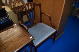A reproduction mahogany carver chair