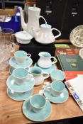 An Art Deco Poole Pottery part tea and coffee service in a mottled and green glaze.