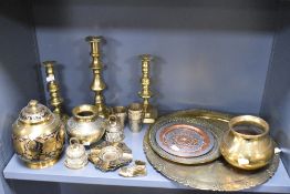 A selection of brass ware, including Indian Lassi cups, charger with traditional Indian scenes,