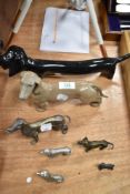 Seven Dachshund studies, including Spanish made Lladro style ceramic study and cast metal examples.