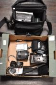 Four cameras and a lens. A hanimex EFP35, a Pentax Optio VS20, a Lumix FS9 and a Finepix A700