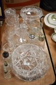 A mixed lot of cut glass, comprising; fruit bowls, glasses, bowls, candle sticks and more, also