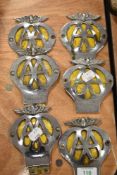 Six collectable vintage AA membership car badges.
