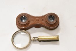 A set of compact vintage 'Vestocular' binoculars and a folding magnifying glass.