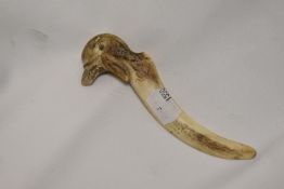 An antique horn letter opener, having carved bird handle, AF.